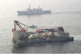 Salvaged mystery ship arrives in Kagoshima Bay for probe